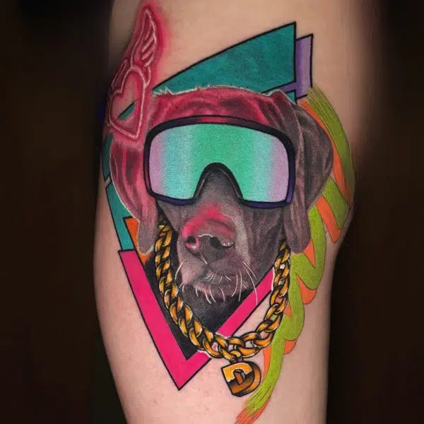 Color tattoo of dog head with sunglasses and gold necklace